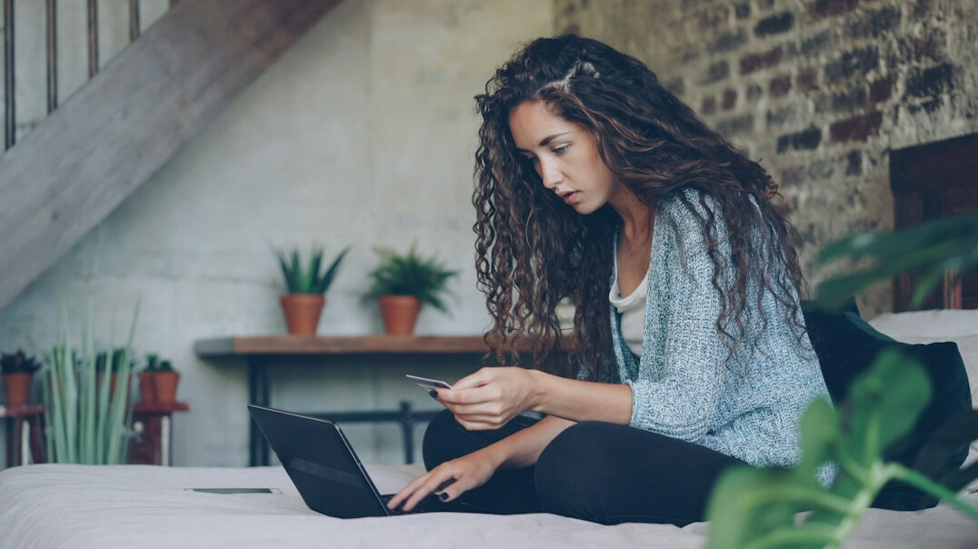 woman calculating expenses at home