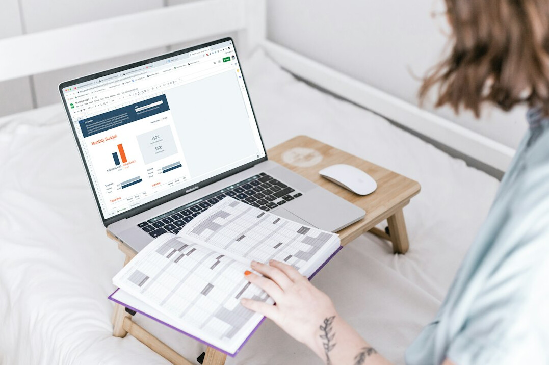 person reviewing budget on laptop